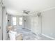 Bright, neutral living room with ceiling fan, accent chairs and cabinet at 1288 Gambel Oaks Dr, Elizabeth, CO 80107