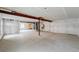 Unfinished basement with concrete floor and exposed support beams, ready for customization and expansion at 1667 Fox Trotter Pt, Castle Rock, CO 80104