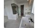 Luxurious bathroom featuring a freestanding tub, glass shower, and modern fixtures at 1667 Fox Trotter Pt, Castle Rock, CO 80104