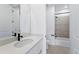 Modern bathroom featuring white marble countertops, black fixtures, and a shower/tub combo for a sleek, clean design at 1667 Fox Trotter Pt, Castle Rock, CO 80104