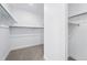 A walk-in closet with ample shelving space, perfect for organization and storage, is ready for personal customization at 1667 Fox Trotter Pt, Castle Rock, CO 80104