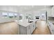 Modern kitchen features a large center island, stainless steel appliances, and an open floor plan at 1667 Fox Trotter Pt, Castle Rock, CO 80104