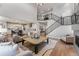 Open concept living area with staircase, seamlessly connected to the modern kitchen at 1667 Fox Trotter Pt, Castle Rock, CO 80104