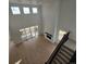 High-ceiling living room featuring hardwood floors, a fireplace, and large windows at 1667 Fox Trotter Pt, Castle Rock, CO 80104