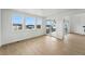 Bright living room featuring hardwood floors, large windows, and sliding door access to the outside at 1667 Fox Trotter Pt, Castle Rock, CO 80104