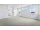 Large loft space featuring carpet flooring and multiple windows that provide ample natural light at 1667 Fox Trotter Pt, Castle Rock, CO 80104