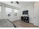 Bright bedroom with large windows, modern furnishings, and a minimalist decor at 688 N Bersshine Ct, Watkins, CO 80137