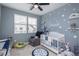 Baby's room featuring natural light from the window, neutral walls with soft accents and white furniture at 688 N Bersshine Ct, Watkins, CO 80137