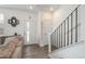 Welcoming entryway with modern staircase, stylish decor, and hardwood floors at 688 N Bersshine Ct, Watkins, CO 80137