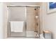 Cozy bathroom with tiled shower/tub and a glass door, perfect for relaxation at 1395 Abilene Dr, Broomfield, CO 80020