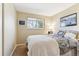 Bright bedroom features a comfortable bed, natural light from a window, and tasteful decor at 1395 Abilene Dr, Broomfield, CO 80020