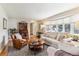 Bright and open living room with large windows, hardwood floors, and comfortable seating at 1395 Abilene Dr, Broomfield, CO 80020