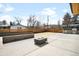 Beautiful backyard with custom built-in seating, a modern firepit, and an outdoor grill at 2170 Vine Ave, Boulder, CO 80304