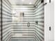 Modern bathroom featuring a sleek glass shower with beautiful tile and a rainfall showerhead at 2170 Vine Ave, Boulder, CO 80304