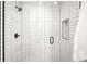Modern shower featuring white subway tile, matte black fixtures, and a convenient built-in niche at 2170 Vine Ave, Boulder, CO 80304
