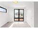 Bright bedroom with large black frame windows, natural light, and closet with sliding doors at 2170 Vine Ave, Boulder, CO 80304