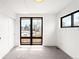 Bright bedroom with large windows offering natural light and scenic views, plus a neutral carpet at 2170 Vine Ave, Boulder, CO 80304