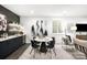 Stylish dining area with modern table, chairs, a sleek wet bar and eye-catching decor at 2170 Vine Ave, Boulder, CO 80304