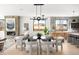 Bright dining room and kitchen area, featuring modern lighting and an open layout at 2170 Vine Ave, Boulder, CO 80304