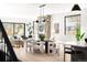Bright dining room with modern chandelier, fireplace, and open floor plan at 2170 Vine Ave, Boulder, CO 80304