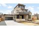 Modern exterior with stone facade, black garage door, walkway and professionally landscaped front yard at 2170 Vine Ave, Boulder, CO 80304