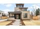 Modern stone facade with a covered front porch, balcony and contemporary design elements at 2170 Vine Ave, Boulder, CO 80304