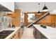 Open concept kitchen with large island and view of the stairway at 2170 Vine Ave, Boulder, CO 80304