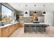 Modern kitchen with a large island, stainless steel appliances, and natural wood cabinets at 2170 Vine Ave, Boulder, CO 80304