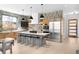 Bright, modern kitchen featuring a large island, stainless steel appliances, and tile backsplash at 2170 Vine Ave, Boulder, CO 80304