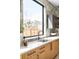 Bright kitchen featuring natural wood cabinets, countertops, and a black faucet at 2170 Vine Ave, Boulder, CO 80304