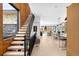 Open-concept living space with wood staircase, hardwood floors and great natural light at 2170 Vine Ave, Boulder, CO 80304
