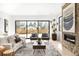 Bright living room with modern fireplace, large windows, and hardwood floors at 2170 Vine Ave, Boulder, CO 80304