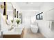 Main bathroom boasts dual vanity, modern fixtures, and a soaking tub with outdoor views at 2170 Vine Ave, Boulder, CO 80304