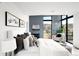 Calming primary bedroom with blue accent wall, deck and mountain views at 2170 Vine Ave, Boulder, CO 80304