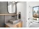 Modern powder room featuring a vessel sink and textured wall at 2170 Vine Ave, Boulder, CO 80304