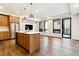 Open concept kitchen and living room with hardwood floors and island at 1908 W 33Rd Ave # 201, Denver, CO 80211