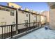 Private patio with a view of the building and surrounding area at 1908 W 33Rd Ave # 201, Denver, CO 80211