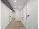 Bright, clean basement featuring laminate flooring and utility access at 7036 S Apache St, Littleton, CO 80120
