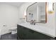 Modern bathroom with stylish vanity, marble countertop, and elegant fixtures at 7036 S Apache St, Littleton, CO 80120