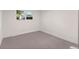 Cozy bedroom with neutral carpet, a window and natural light at 7036 S Apache St, Littleton, CO 80120