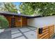 Stylish front porch featuring wood accents, a modern mailbox, and decorative concrete pavers at 7036 S Apache St, Littleton, CO 80120
