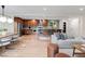 Bright and airy living space open to kitchen and dining, with stylish finishes at 7036 S Apache St, Littleton, CO 80120