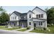 Charming two-story home featuring a modern design with gray and white color scheme, and well-manicured lawn at 6639 N Parterre Pkwy # 1, Thornton, CO 80602