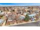 Aerial view of the neighborhood with a mix of single-Gathering homes and a partially developed nearby lot at 329 2Nd St, Frederick, CO 80530