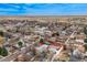 The aerial view with an outlined perimeter shows houses and buildings of the community at 329 2Nd St, Frederick, CO 80530
