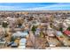 Wide aerial view of the neighborhood showcasing houses, streets, and surrounding landscape at 329 2Nd St, Frederick, CO 80530