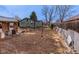 A backyard that includes a garden area for growing plants and is partly covered in hay at 329 2Nd St, Frederick, CO 80530