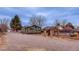Charming home with a gravel driveway and a backyard gazebo, ideal for outdoor relaxation at 329 2Nd St, Frederick, CO 80530