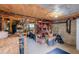 Unfinished basement area, perfect for storage or a workshop, featuring exposed beams and storage racks at 329 2Nd St, Frederick, CO 80530