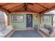 Inviting covered porch with comfortable seating, ceiling fan, and a warm, welcoming ambiance at 329 2Nd St, Frederick, CO 80530